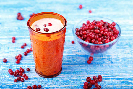 healthy nutritious breakfast with milk, cottage cheese, and cranberry - Cranberry smoothie in a glassの写真素材