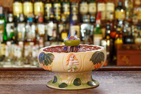 Zombie volcano Cocktail - Dark and Light Rums, 151-proof Rum and Various Syrup, Grenadine, Grapefruit Juice, Lime Juice, Absinth and Cane Sugar. Cocktail for a several peoplesの写真素材