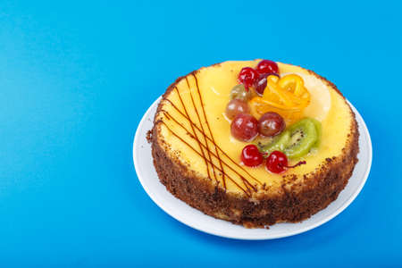 delicious birthday cake, cream cake with cherries, oranges and chocolate, space for text