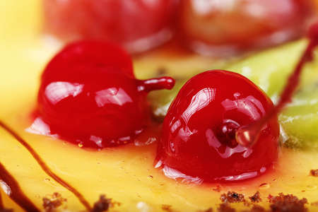 canned cherries as decoration on a cake, close-upの写真素材