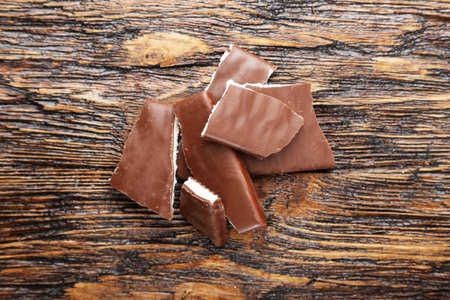 Chopped chocolate on the wooden deskの写真素材