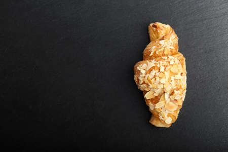 croissant on a black background, top view, space for text