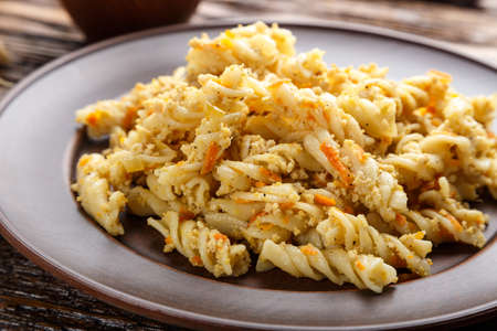 nautically pasta in the clay plate on a wooden backgroundの写真素材