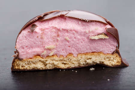 Round chocolate candy on a black slate boardの写真素材