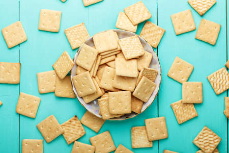 light delicious breakfast crispy crackers on a plate on a wooden backgroundの写真素材