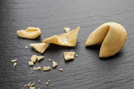 traditional Chinese cookies with wishes on a black background. ryados with whole cookies is a broken cookieの写真素材