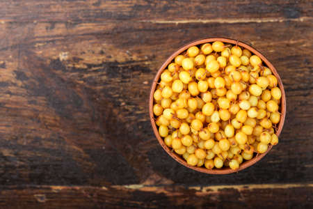 berries of sea-buckthorn close-up on a plate, vitamin product for strengthening immunityの写真素材
