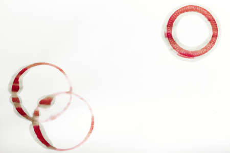 traces of a glass with red wine on paper, space for textの写真素材