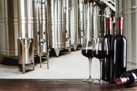 wine in bottles on the background of cisterns with wine at a winery, wine production
の写真素材