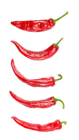 A lot of red hot chili pepper isolated on white backgroundの写真素材