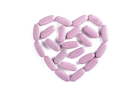 tablets are scattered in the form of heart, the concept of treatment of heart diseases, isolated