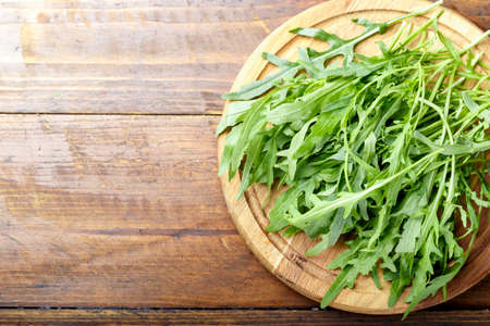 Fresh arugula leaves rucola, fresh rucola  in a plate, space for text.の写真素材