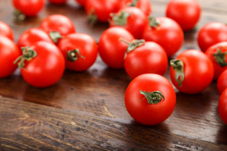 Fresh tomatoes. It can be used as background. (selective focus).Delicious red tomatoes. A pile of tomatoes. Summer tray market agriculture farm full of organic tomatoes. の写真素材