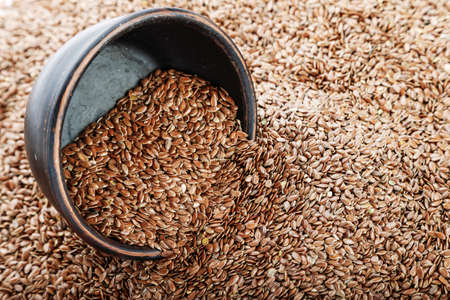 The seeds of flax in a plate. Horizontal photoの写真素材