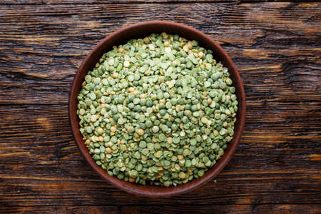 green dried peas in a plate. view from above. place for textの写真素材