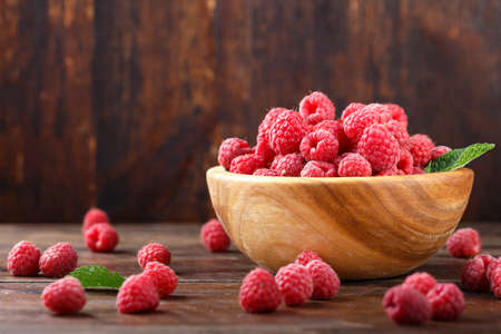 ripe raspberries on a plate, close up