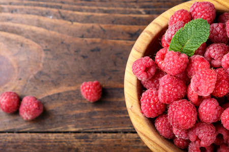 ripe raspberries on a plate, close upの写真素材