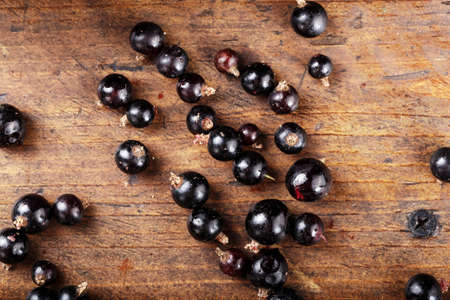 natural antioxidant fresh organic currant on a wooden background, space for textの写真素材