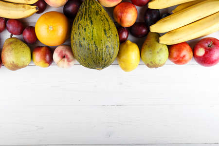 fruit background with exotic fruits on white background, fruit detox, space for textの写真素材