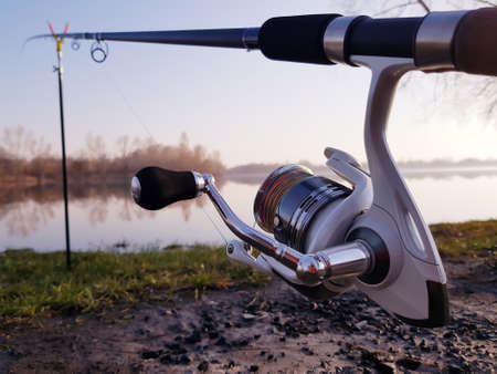Fisherman's reel, mounted on a fishing rod. Feeder fishing in English style.の写真素材