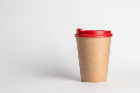 coffee to go in a disposable cup on a white background, place for textの写真素材