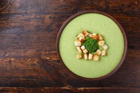 cream soup with broccoli with rusks and dumplings top view. appetizing vegetable vegan productの写真素材