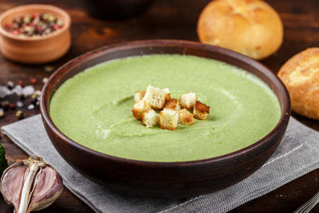 cream soup with broccoli with rusks and dumplings top view. appetizing vegetable vegan productの写真素材
