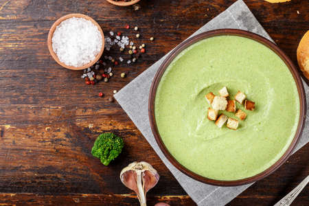 cream soup with broccoli with rusks and dumplings top view. appetizing vegetable vegan productの写真素材