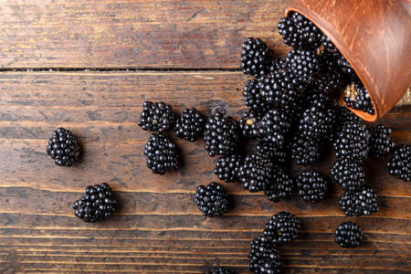 Blackberry on a wooden background