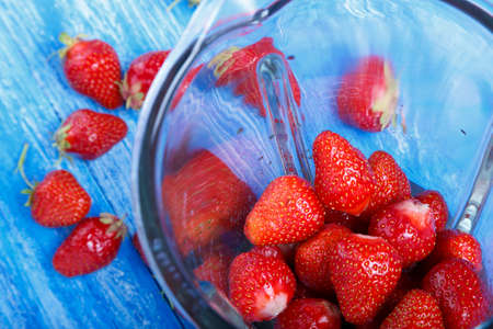 fresh raw strawberries in a blender. cooking strawberry smoothiesの写真素材