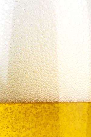 beer foam close-up. beer in a glass, place for text