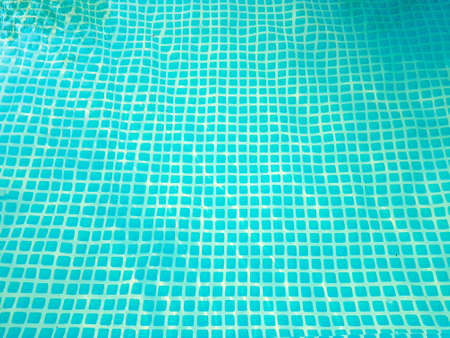 bottom of the pool with water blue mosaic. competitions in swimming. place for textの写真素材