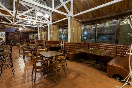 empty restaurant in the evening, a lot of seating for guests. music club, nightlife in the city. Kiev. March 14. 2018のeditorial素材