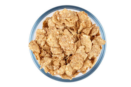 corn flakes, dry breakfast, in a plate on a white background, isolated, place for text