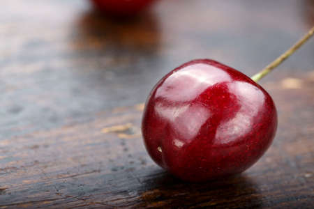sweet cherry on a wooden background close-up. space for textの写真素材