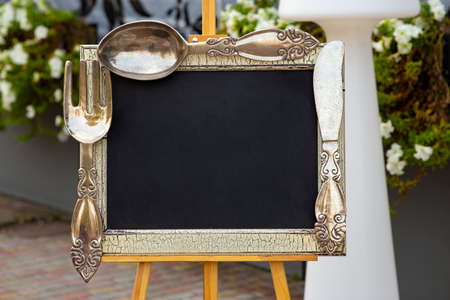 decorative frame for the menu with cutlery at the edges.の写真素材