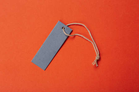 an empty tag on a string to sign a gift or merchandise. place for textの写真素材