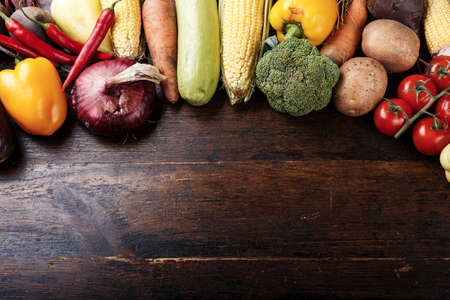 vegetarian vegetables menu on wooden background. space for textの写真素材