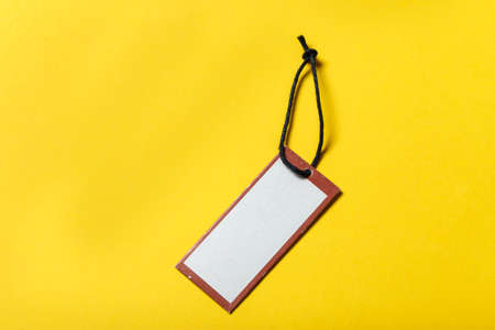 rectangular label without an inscription on a yellow background. space for textの写真素材