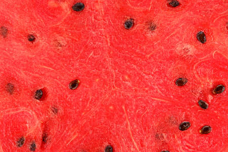 sliced watermelon background. clearly visible texture berries, moisture and seeds