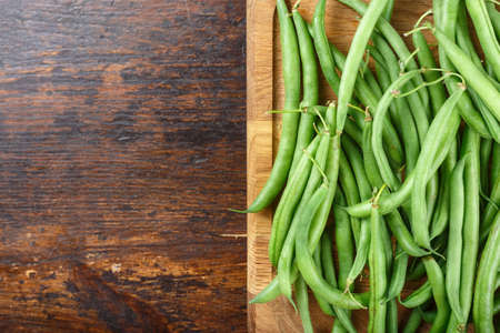 asparagus beans on a cutting board on the kitchen table. space for text