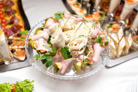 Various snacks from meat and seafood on the buffet table. birthday celebration in a restaurant. cateringの写真素材
