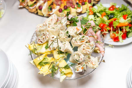 Various snacks from meat and seafood on the buffet table. birthday celebration in a restaurant. cateringの写真素材