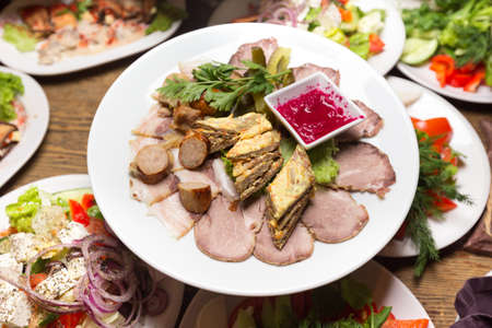 meat antipasti appetizer. different festive dishes on the table in the restaurantの写真素材