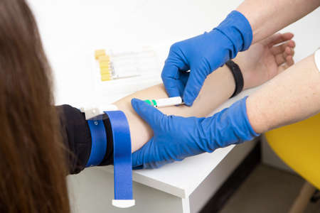 blood sampling from a patient's vein in the laboratory. AIDS and infection testingの写真素材