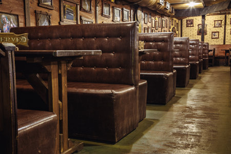 Kiev, Ukraine- March 19, 2018. leather sofas at the tables are in a beer pub or in a nightclub.のeditorial素材