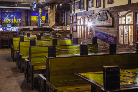Kiev, Ukraine-March 19, 2018. Traditional Irish beer pub with a wooden interior. many empty tables and chairs.のeditorial素材