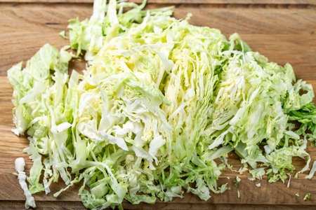 Chopped savoy cabbage on a wooden board. Healthy foodの写真素材
