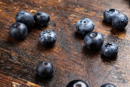 Blueberries background. Blueberry border design. Ripe and juicy fresh picked bilberries close up.の写真素材