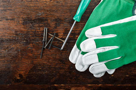 Various tools for work at home and for repair on a wooden background. Place for textの写真素材